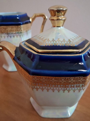Porcelain sugar bowl and creamer set used