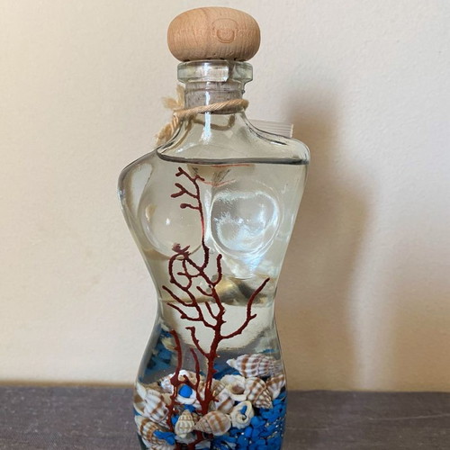 Female figure candle new with shells and stones