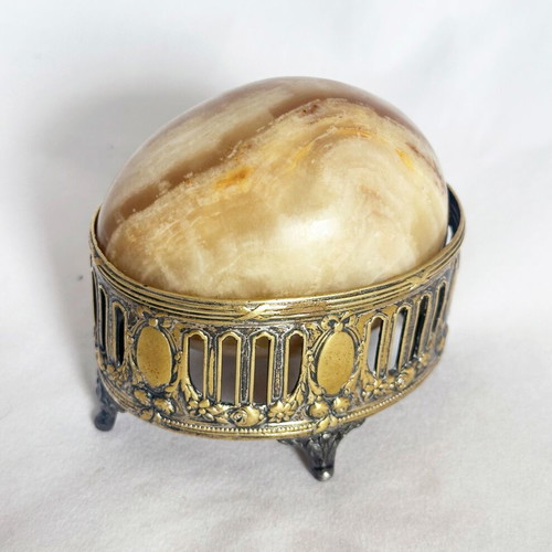 Vintage decorative egg from natural onyx stone in carved silver-plated base used