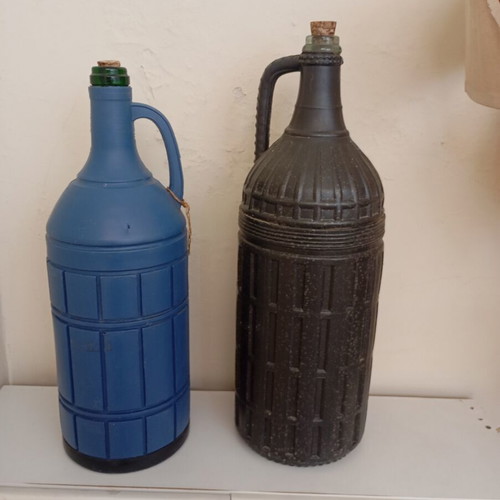 Glass bottles set of 2 used, one with moisture marks