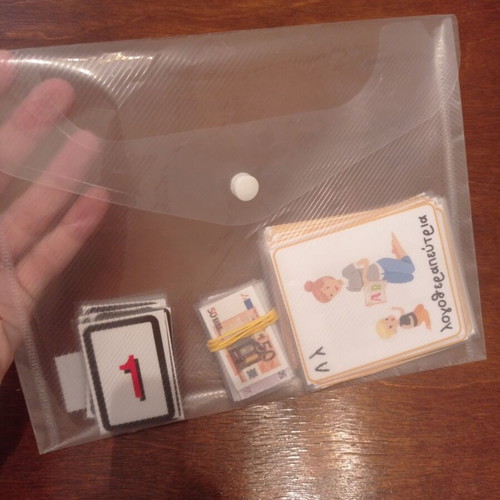 Educational laminated cards with alphabet, money, and numbers