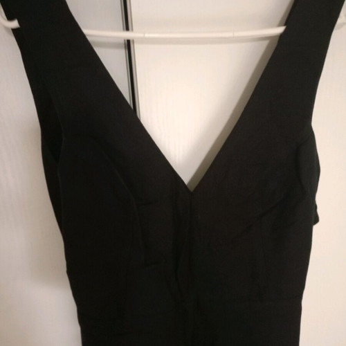 Black one-piece jumpsuit like new, deep neckline and back tie, size S