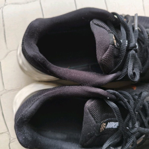 Nike shoes size 38.5 used, black with gold logo, athletic