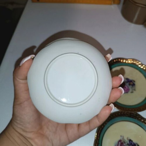 Vintage porcelain plates set of 4 with romantic design and gold trim used