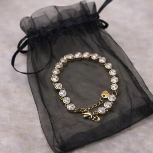 Gold bracelet with white stones like new