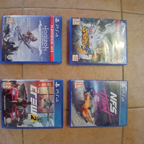 PlayStation 4 base console 500GB used with 4 games