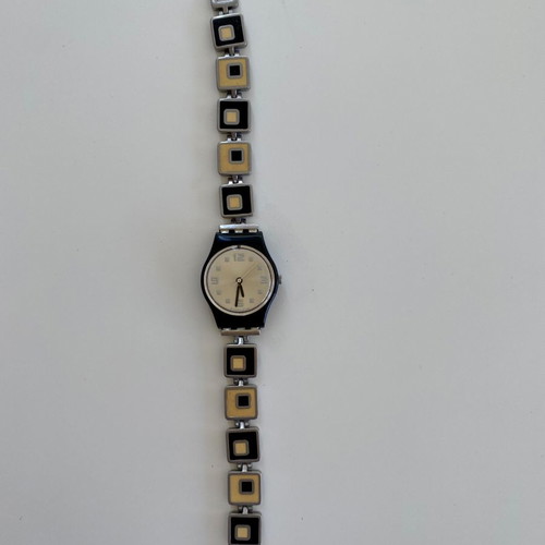 Swatch analog watch used with silver strap-bracelet