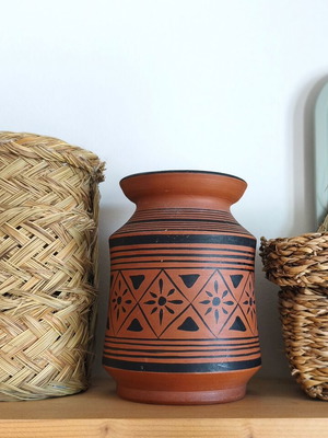 Handmade ceramic terracotta vase used with wear