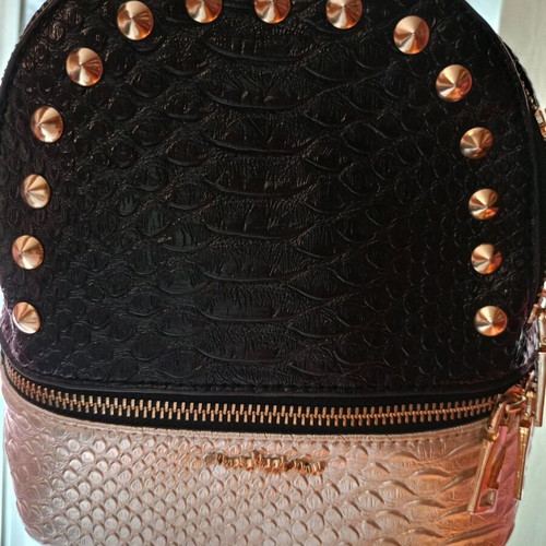 Small backpack like new, black and gold