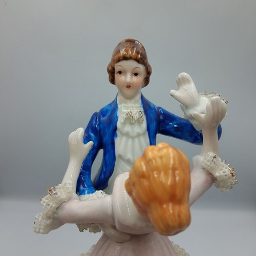 Vintage porcelain music figurine of dancing couple, like new