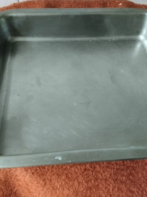 Deep stainless steel baking tray