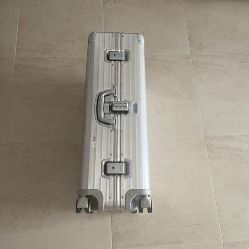 Rimowa travel bag used, silver color, slight defect