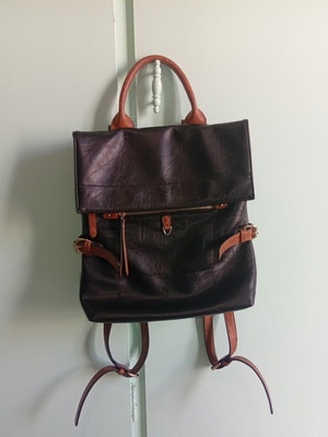 Backpack bag like new, black and brown synthetic leather with decorative buckles
