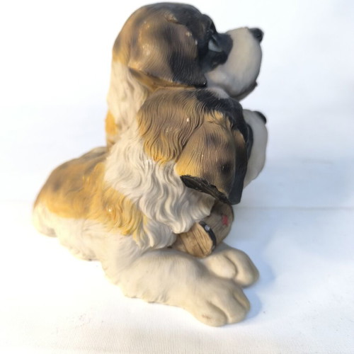 Decorative resin figurine of two puppies used