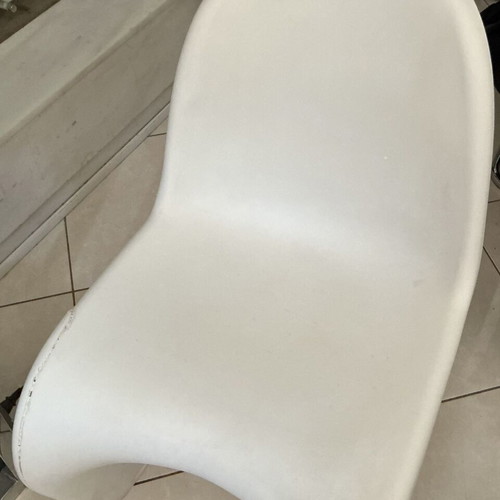 White modern plastic chair with crack