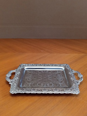 Vintage decorative tray with embossed designs, silver color
