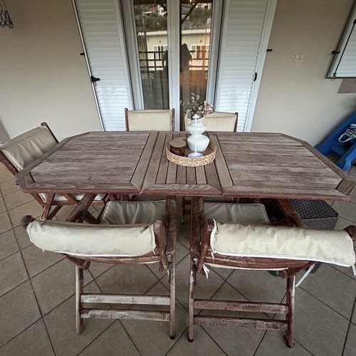 Outdoor wooden dining set used with 6 chairs and cushions