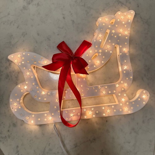 Christmas sleigh used with bow and light