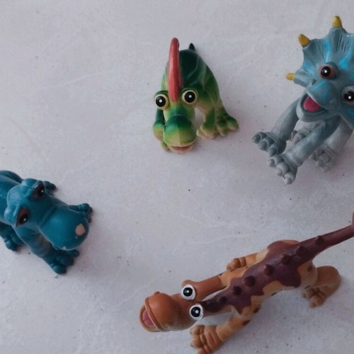 Dinosaurs cartoon toy figures set of 4 like new