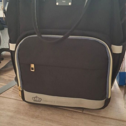 Lequeen Backpack Diaper Bag Black like new with changing mat and bottle warmer
