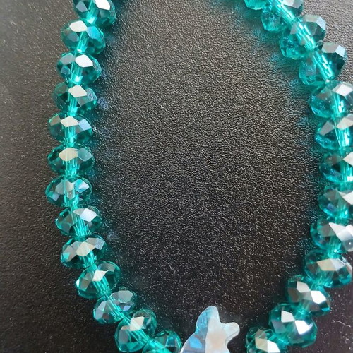 Bracelet with crystal beads used, emerald/petrol color with fish motif