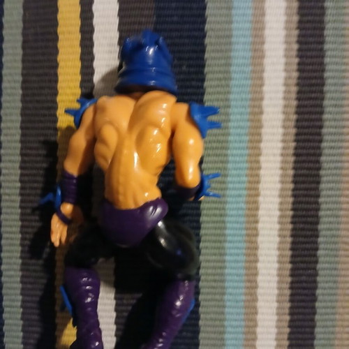 Shredder action figure used with missing parts