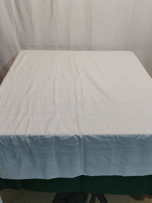 Woven bed sheet used with time stain from 1930 era