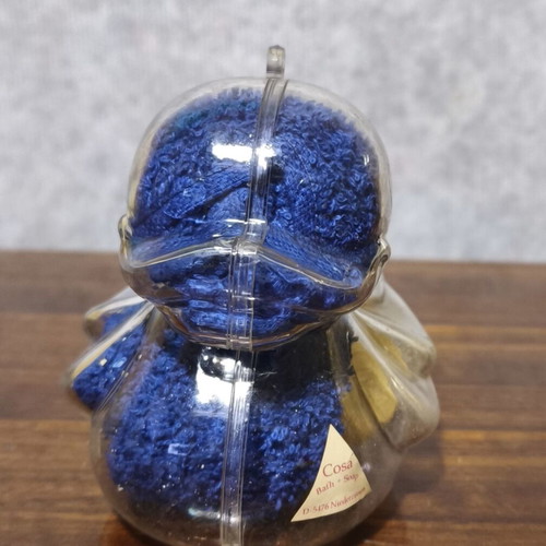 Decorative plastic duck like new with towel and small soap
