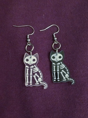 Skeleton cat earrings, pair, black and transparent
