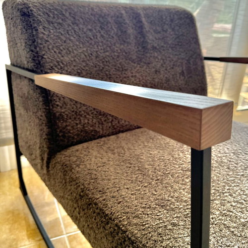 Rocking armchair with grey boucle fabric