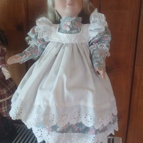 Porcelain doll like new with vintage lace dress and floral details