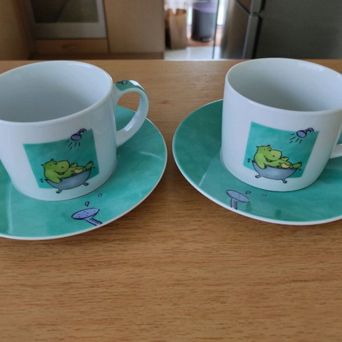 Set of 2 coffee cups with saucers like new, turquoise with hippopotamus