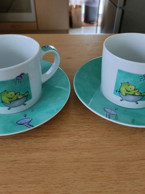 Set of 2 coffee cups with saucers like new, turquoise with hippopotamus