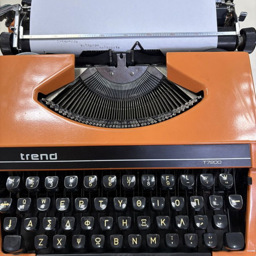 Vintage Trend Typewriter used with ribbon and case, orange color