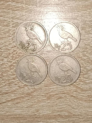 Indonesian coins used, 4 pcs 25 Rupiah (1971)