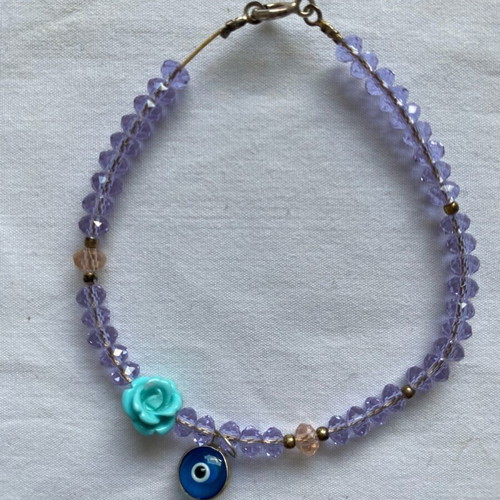 Lilac bracelet like new with beads and charms