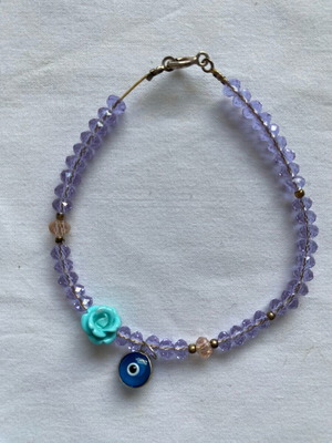 Lilac bracelet like new with beads and charms