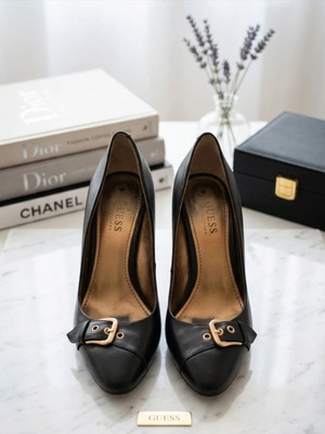 Guess black leather high heel pumps used with gold details