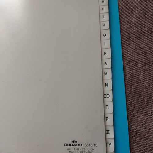 Binder with index used, includes plastic sleeves and lined A4 sheets