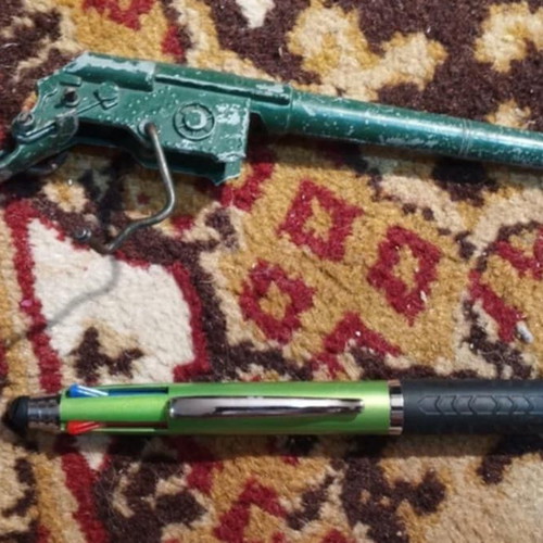Green metal cannon from 1970s tank used
