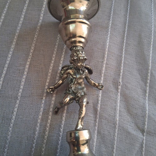 Vintage candlestick with cherub figure