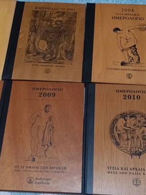 Collectible calendars like new with wooden cover