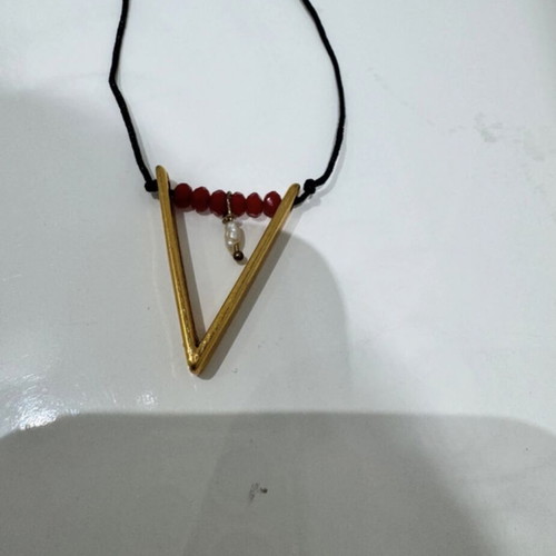 Handmade boho-vintage necklace with gold detail and pearl