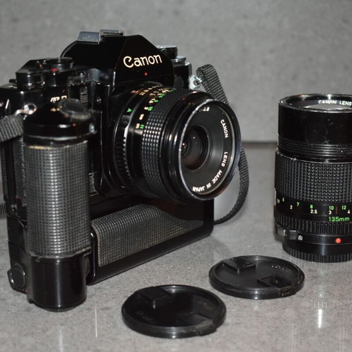 Canon A-1 collectible pack like new with Motor Drive, strap and 35mm f/2.8, 135mm lenses