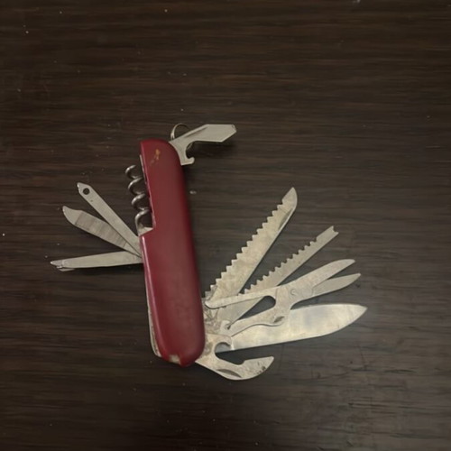 Multi-tool Swiss knife type used, compact pocket tool