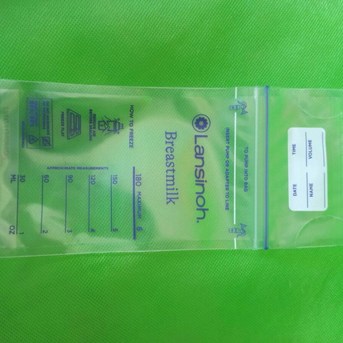 Cangaroo Cara manual breast pump like new with 30 Lansinoh milk storage bags