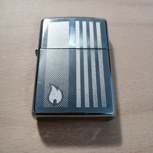 Zippo lighter used with engraved decorative design