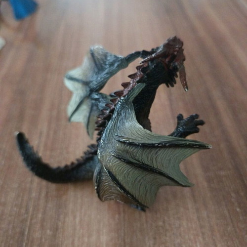 Dragon used, 11cm tall, missing finger on right hand