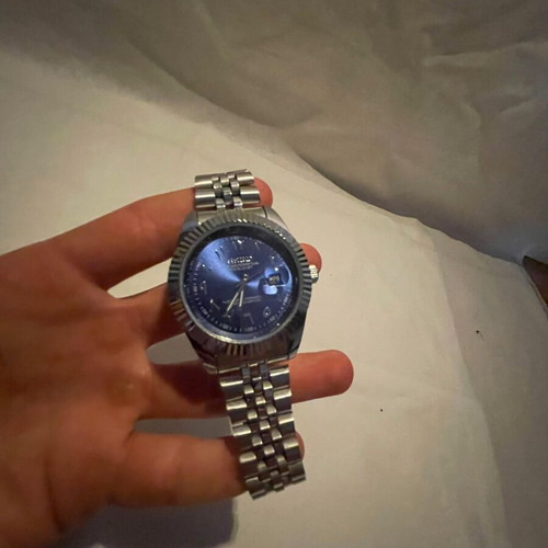 Seiko watch with blue dial and silver bracelet