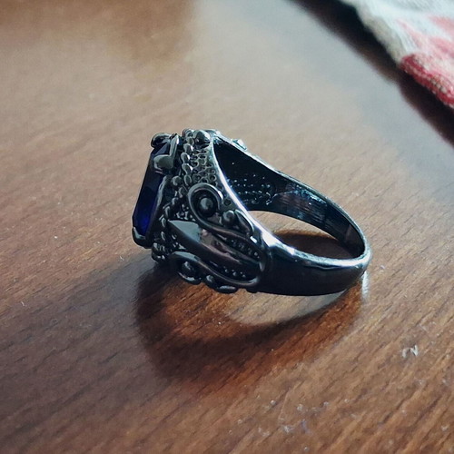 Ring with blue sapphire new, black rhodium plating